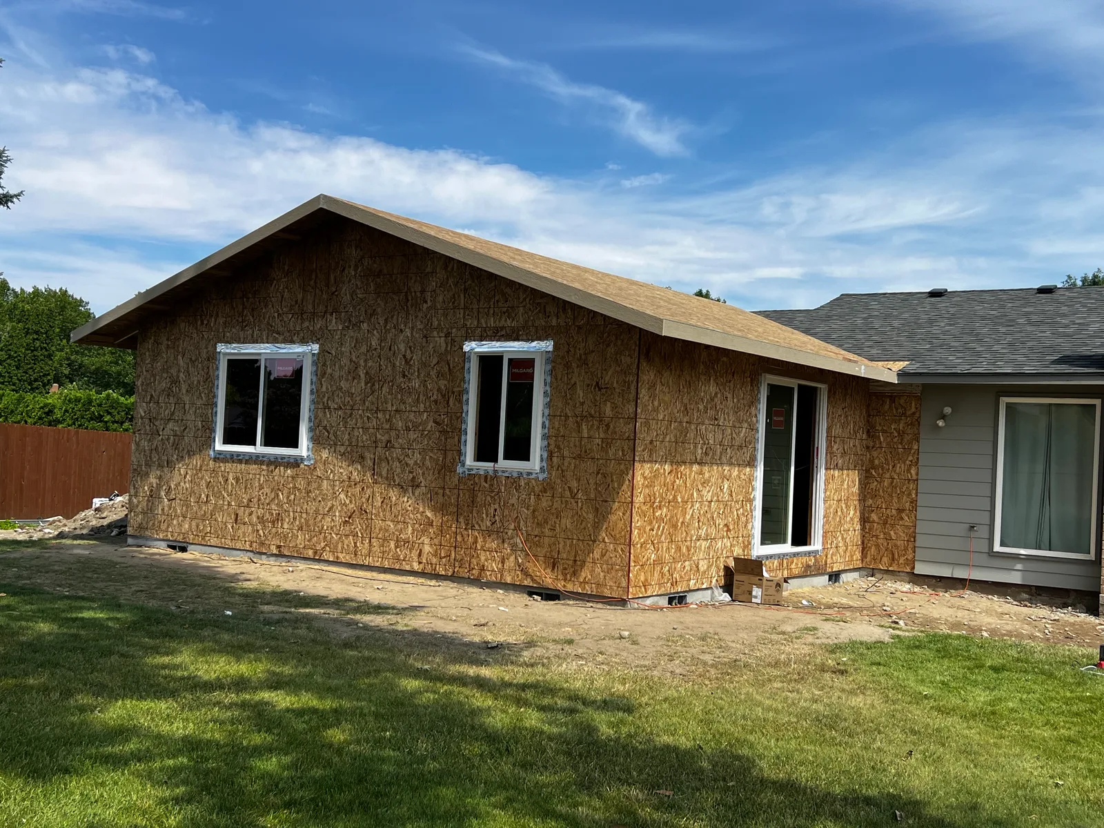 Finished ADU shell with windows and sliding door installed