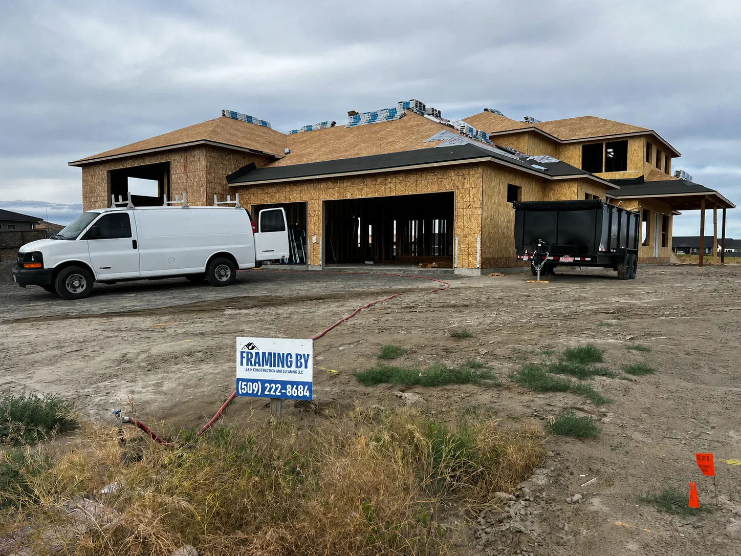 Custom home jobsite exterior with the framing sign taken down