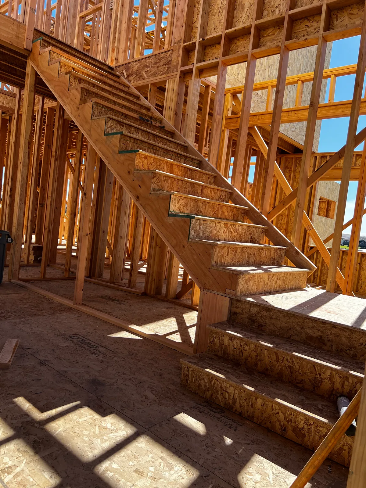 Framed staircase in two-story custom home