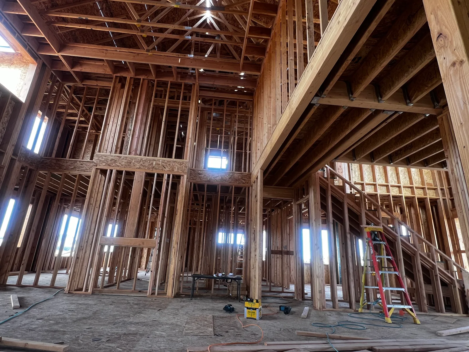 Vaulted two-story interior framing with tall windows